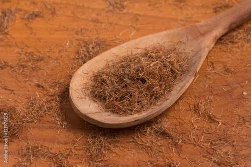 Dry Corn Silk Herb into a spoon. Stigmata Maydis photo