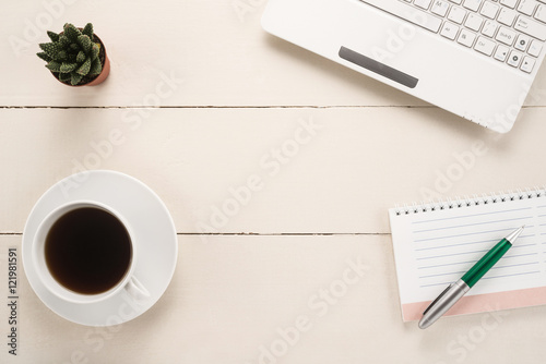 Office table with cup of coffee 