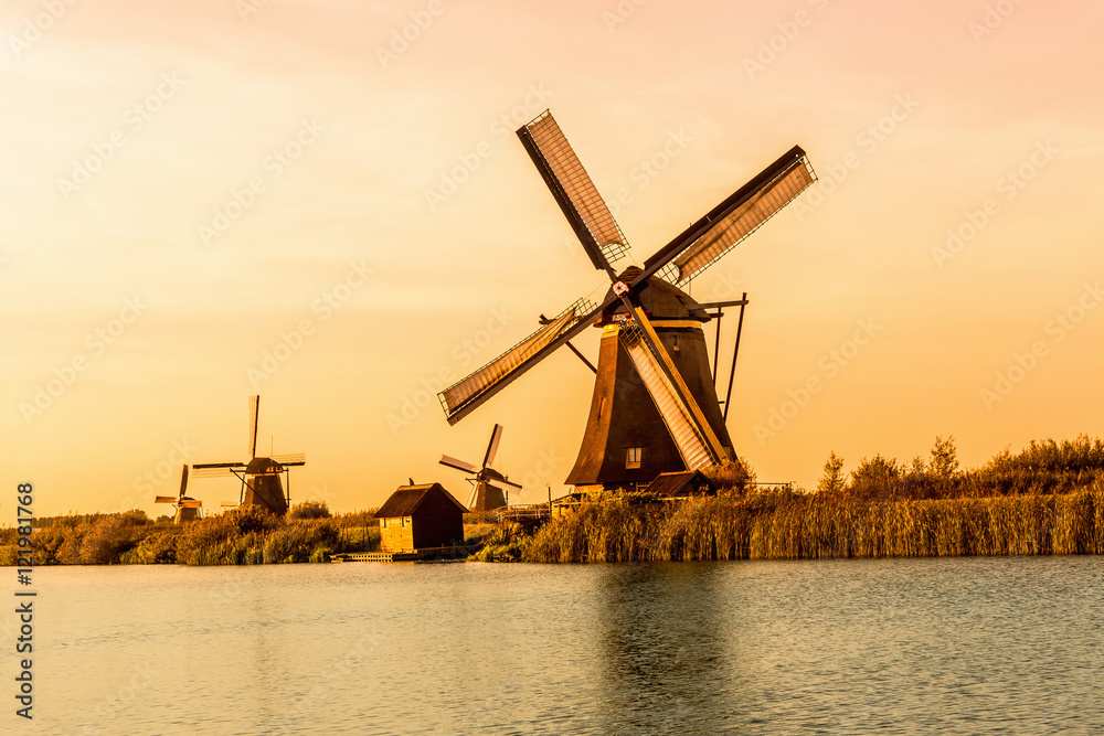 Windmills of Kinderdijk near Rotterdam in Netherlands. Colorful spring scene in the famous Kinderdijk canals with windmills, UNESCO world heritage site