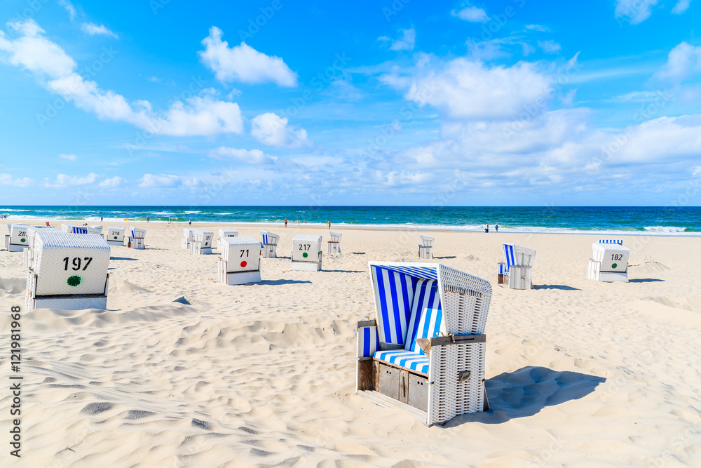 Chairs on white sand beach in Kampen village, Sylt island, Germany