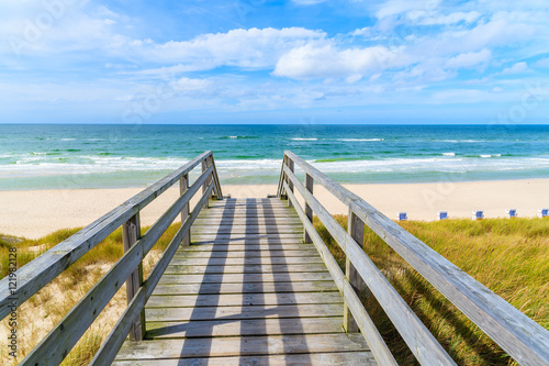 Wooden walkway on sand dune leading to beach in List village, Sylt island, Germany