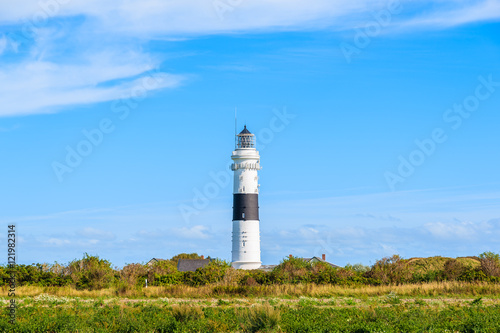 Lighthouse on green meadow in countryside landscape of Sylt island  Germany