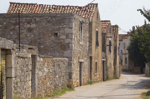 Historical lane in village Nevidane, Croatia photo