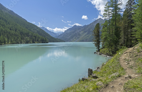 The trail runs along the shore of the Kucherla lake. Altai Mount