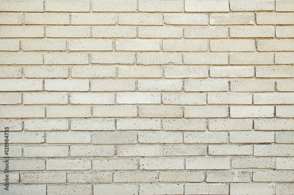 Fototapeta premium Old beige brick wall background texture