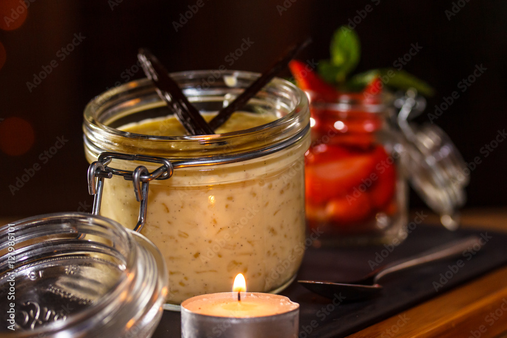 Rice porridge with vanilla and strawberries is in the evening in Rice porridge with vanilla and strawberries is in the evening in