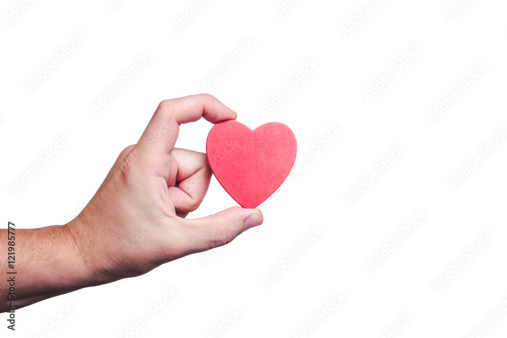 Fototapeta premium Male hand holding red wooden heart shape background.