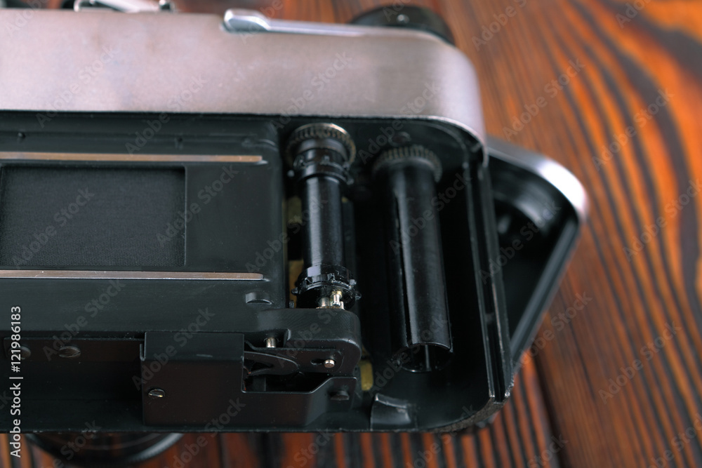 The old film camera on wooden table. The old film camera on wooden table.