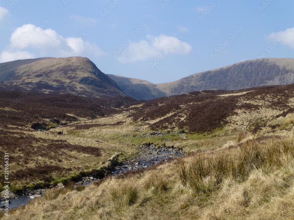 View of hills and moorland at the top of the Grey Mare's Tail waterfall, near Moffat, Southern Scotland on a sunny day in early Springtime View of hills and moorland at the top of the Grey Mare's Tail waterfall, near Moffat, Southern Scotland on a sunny day in early Springtime