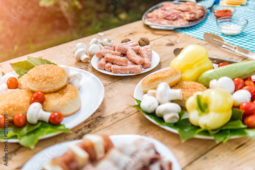 Table with food and drink ready for barbecue party