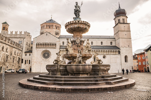 The Neptune fountain in Cathedral Square, Trento, Italy photo