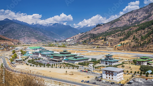 mountain landscape with village and mini airport photo