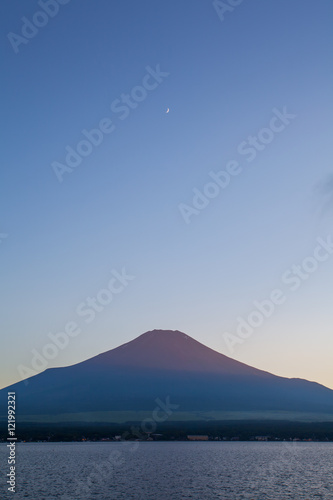 Red color at Top of Mountain Fuji during sunset at Yamanaka lake in summer