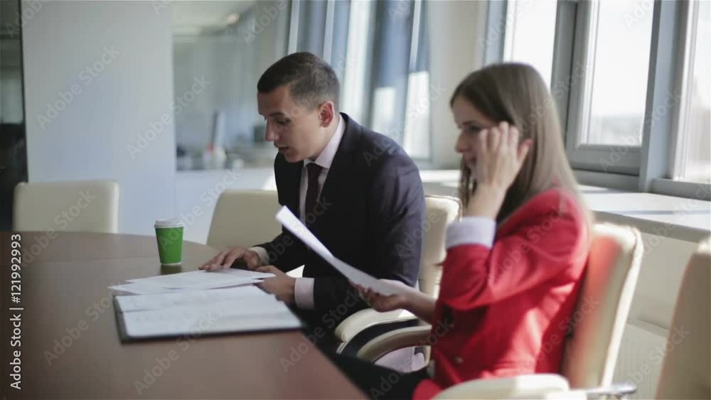 Businessman is reading aloud a document and gesturing. Businessman is reading aloud a document and gesturing.