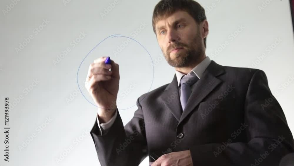 bearded businessman draws the schedule, circuit block and diagram bearded businessman draws the schedule, circuit block and diagram