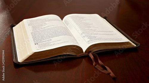 Holy Bible Open on a Wooden Table