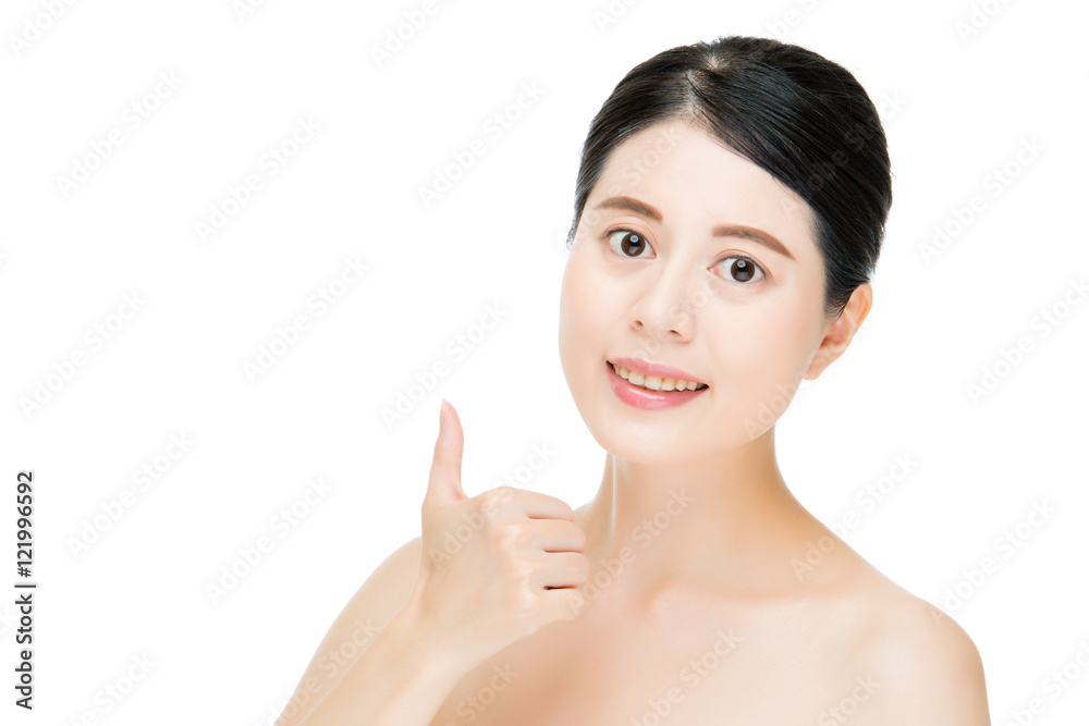 Close up of young smiling woman with finger good gesture Close up of young smiling woman with finger good gesture