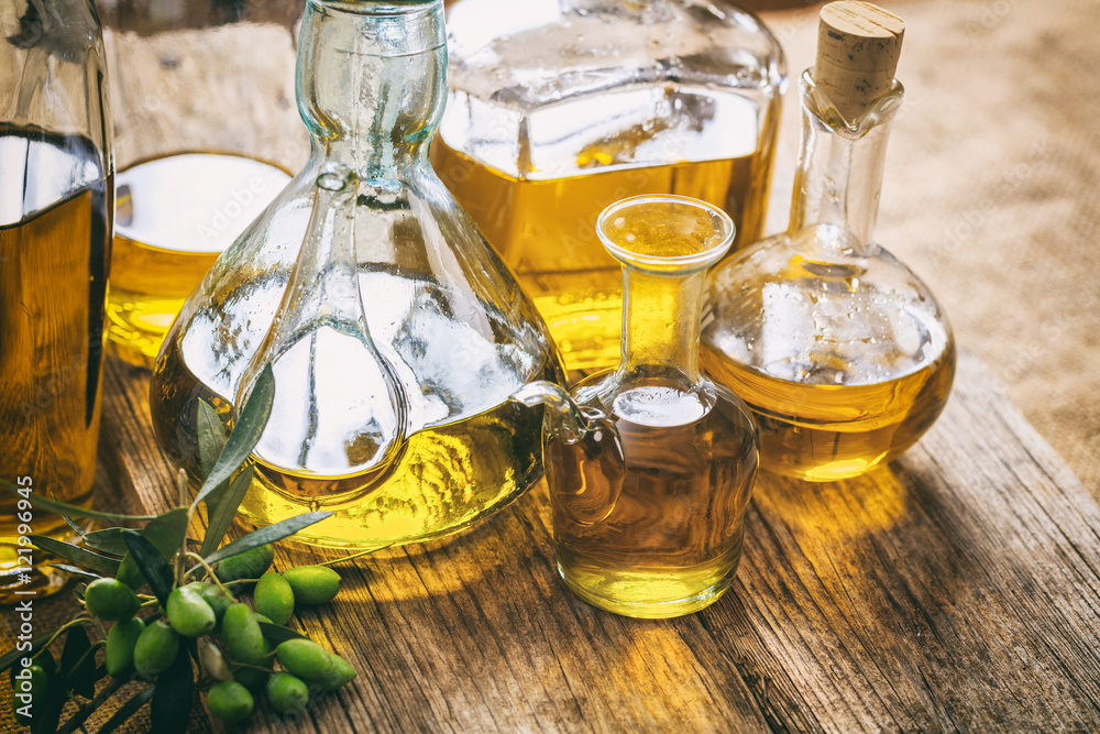 Bottles of olive oil on a table Bottles of olive oil on a table