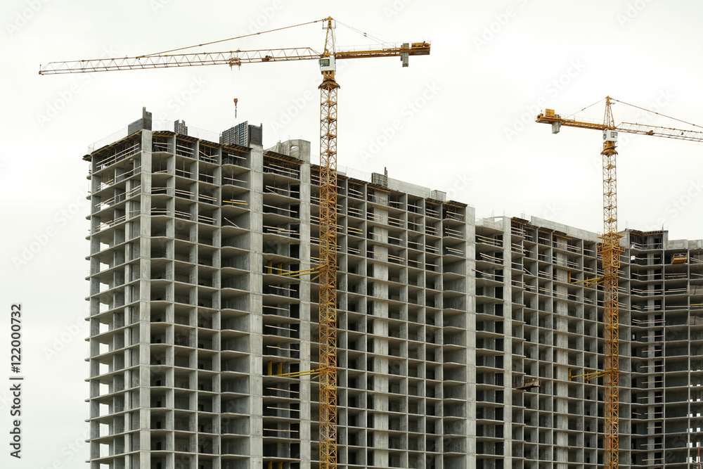 Crane and building construction on sky background Crane and building construction on sky background