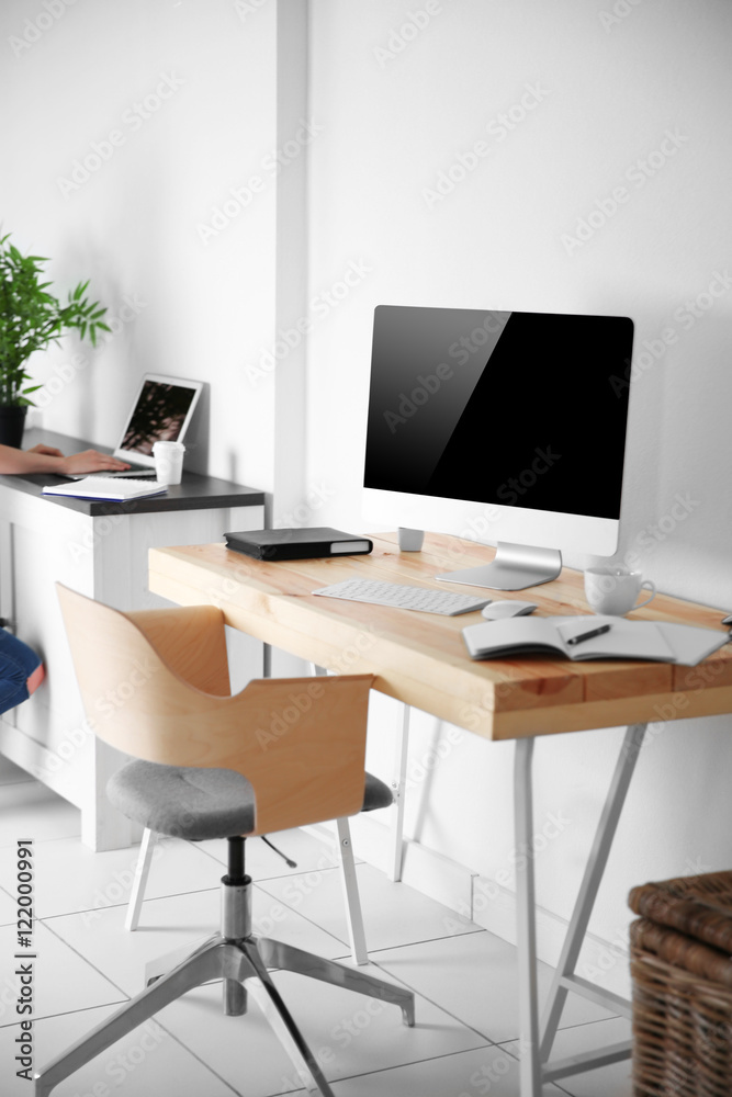 Working place on white wall background Working place on white wall background