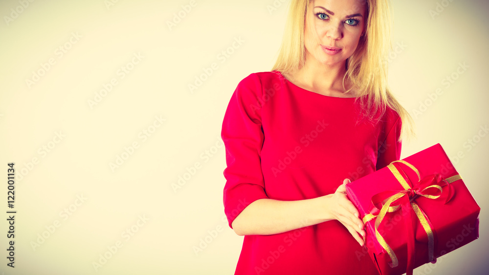 Beautiful woman with red gift. Beautiful woman with red gift.