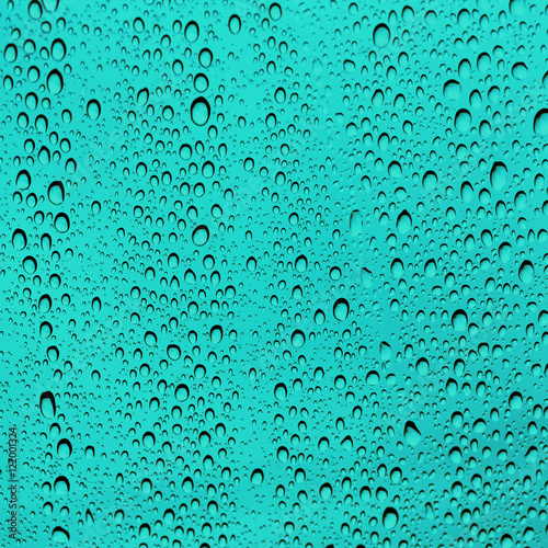 Turquoise Water Drops On Glass