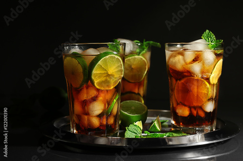 Photography Metal tray with cuba libre cocktails on dark background