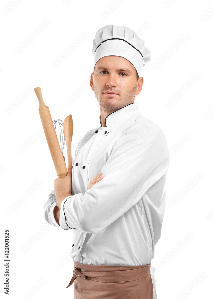 Young chef cook with cutlery isolated on white Young chef cook with cutlery isolated on white