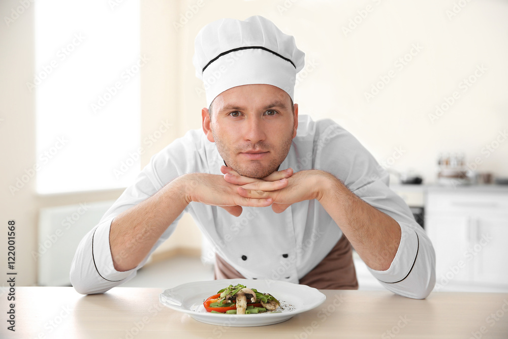 Young chef cook and tasty dish in kitchen Young chef cook and tasty dish in kitchen
