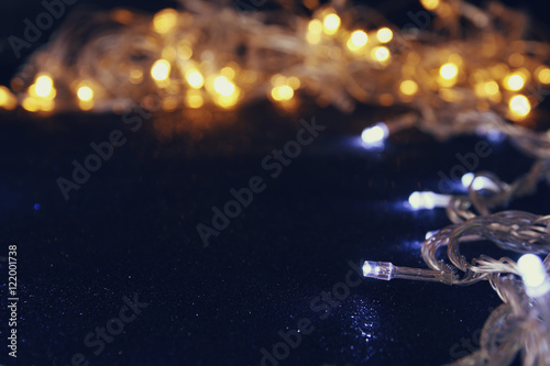 Abstract image of Christmas garland lights on glitter background