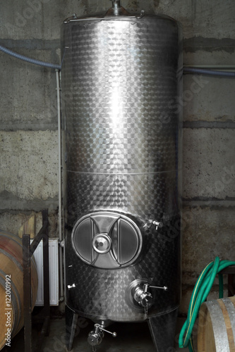 Stainless steel reservoir for wine on factory photo