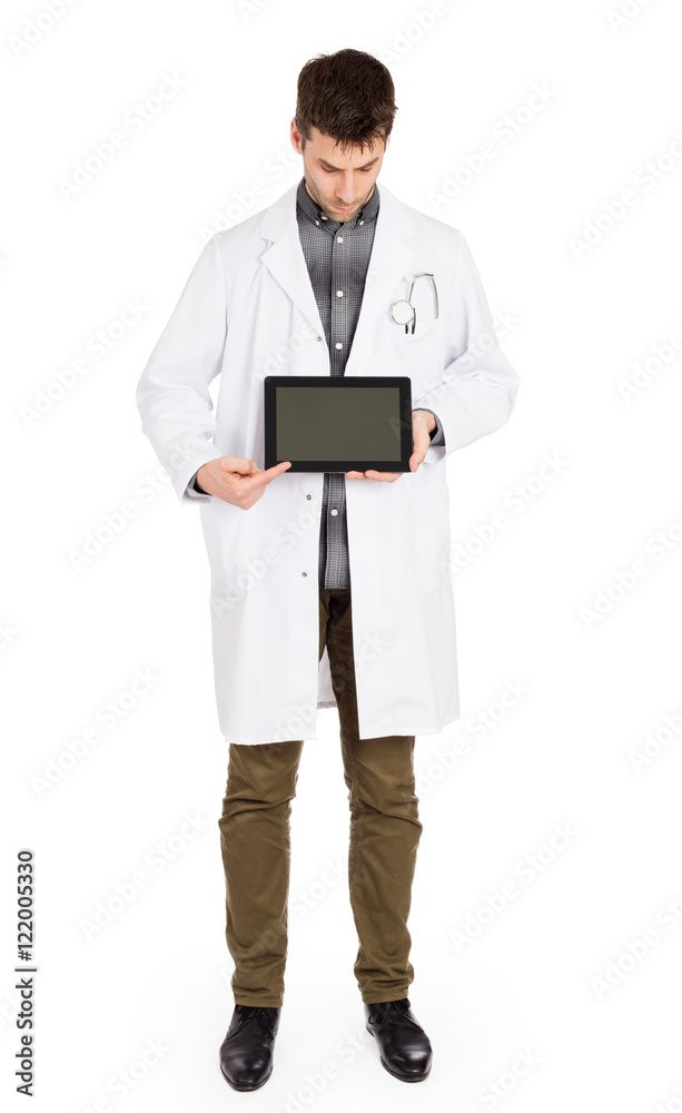 Doctor holding tablet with copy space and clipping path for the Doctor holding tablet with copy space and clipping path for the