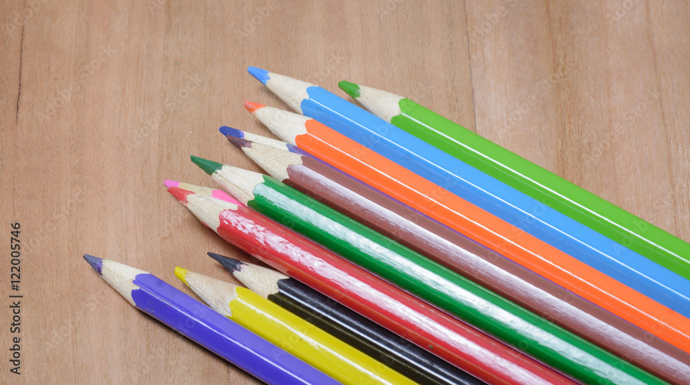 Color pencils on wood table Color pencils on wood table