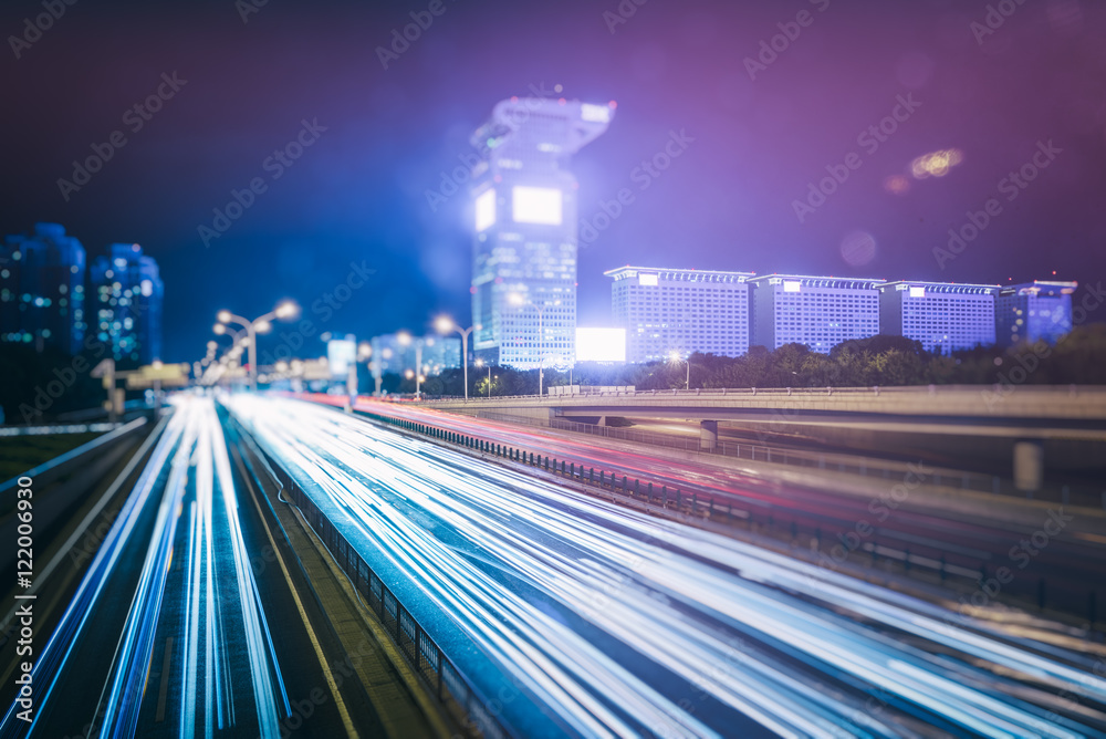 Obraz premium traffic light trails on urban street in city of China.