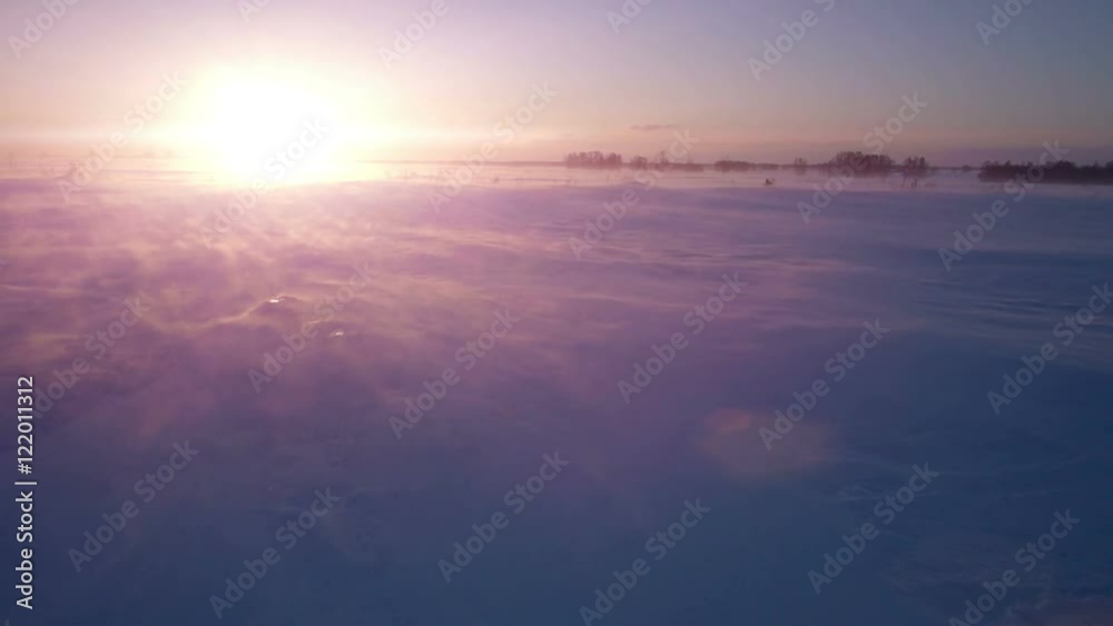 Snowstorm, wind and sun. Cold arctic. Frozen snow drifts. Winter weather. Snowstorm, wind and sun. Cold arctic. Frozen snow drifts. Winter weather.