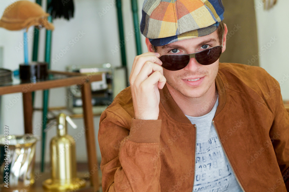 Obraz premium beautiful young man in vintage clothing looking at the camera