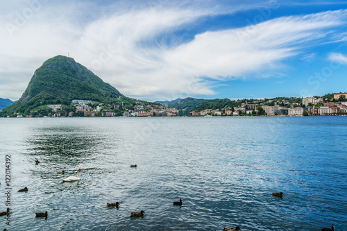 Fototapeta Embankment of Lugano Lake and mountains. Lugano, Switzerland.