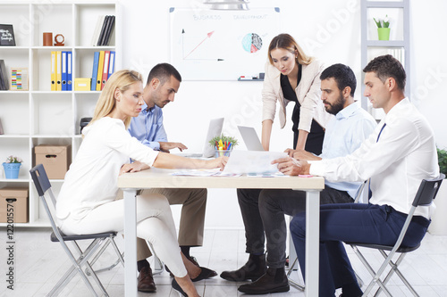 Group Of Business People Having Meeting In Office