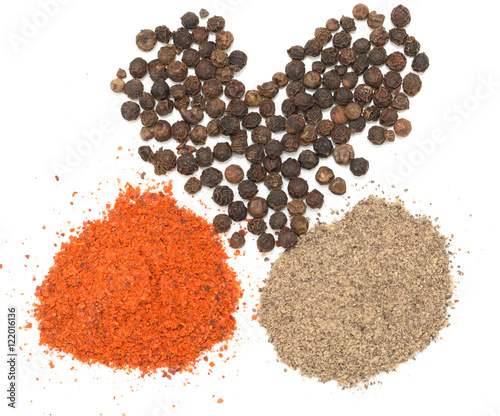 red and black pepper on white background