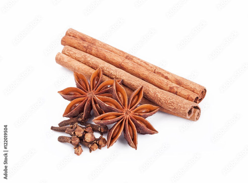 Cinnamon sticks and star anise isolated over a white background Cinnamon sticks and star anise isolated over a white background