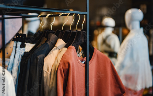 Clothes on racks in a fashion boutique