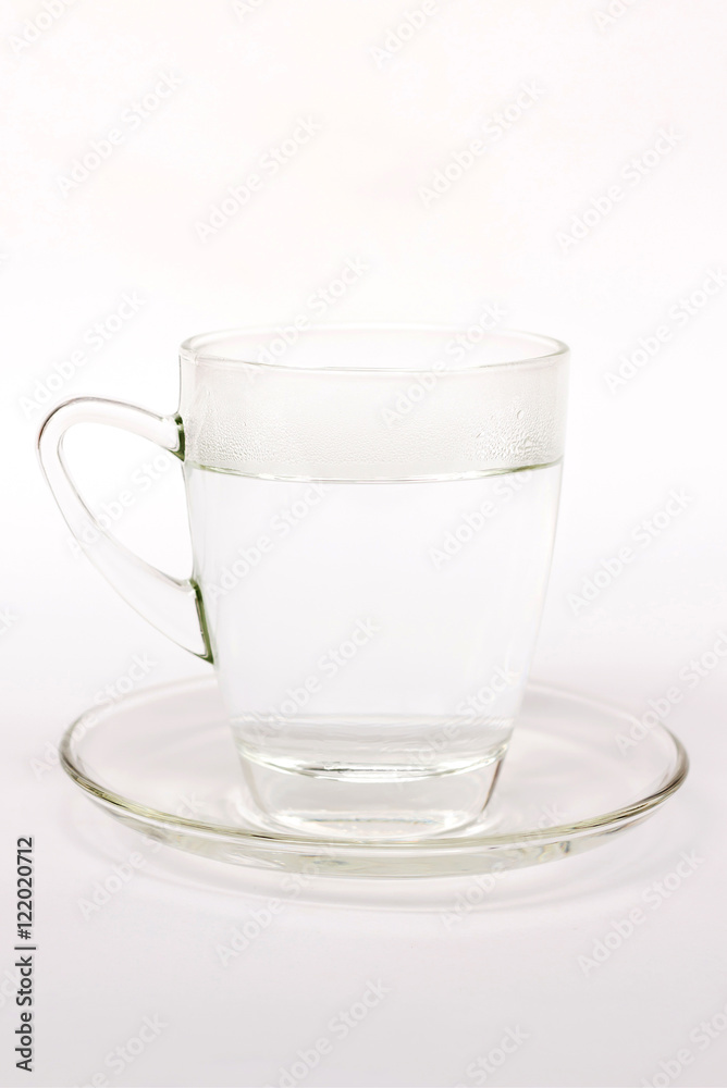 Warm water with stream of water on glass Warm water with stream of water on glass