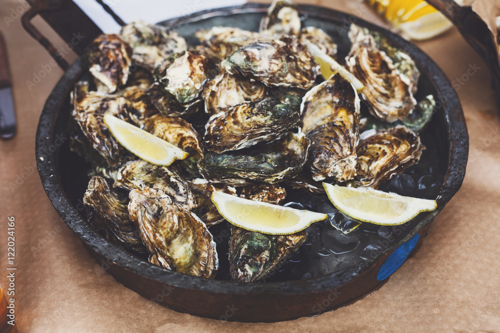 Plenty of seafood, oysters on grill pan Plenty of seafood, oysters on grill pan