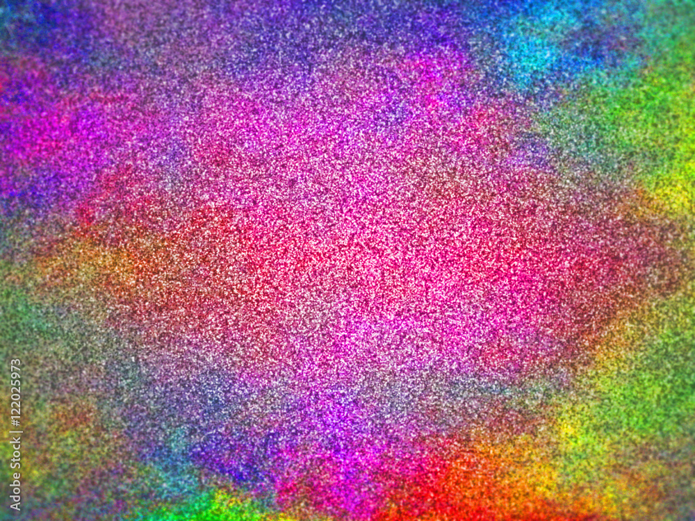 very colorful glitter in shades of pink,  green, blue, purple, red and yellow lit by a bright spotlight