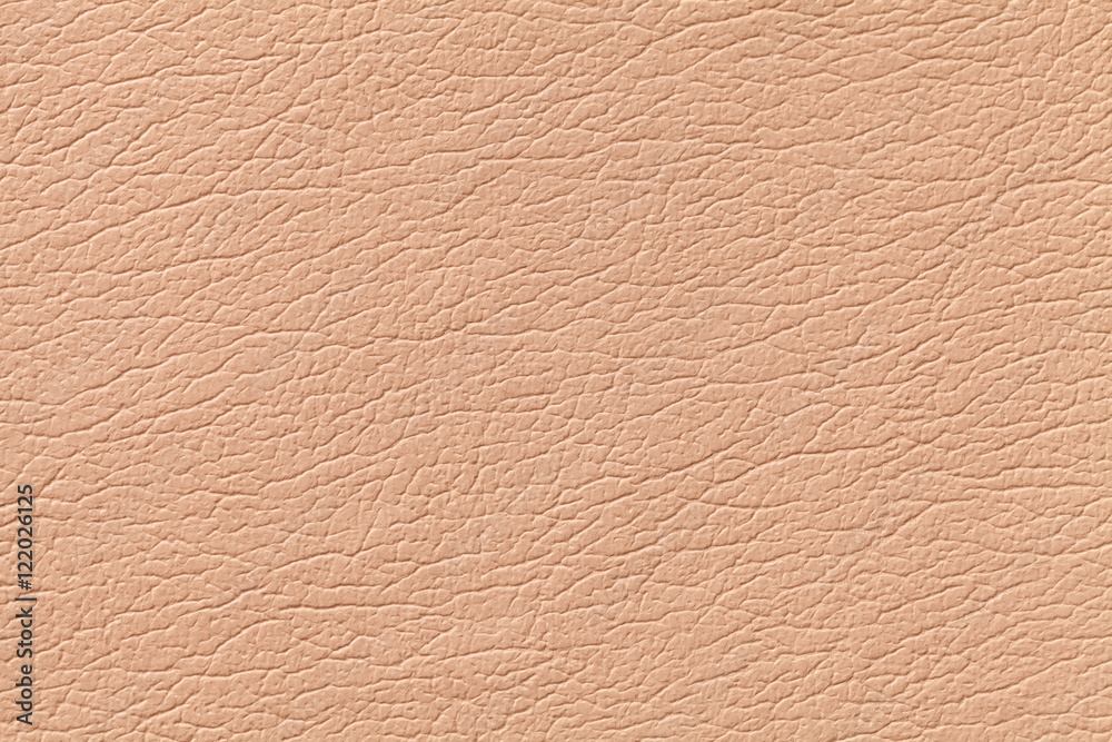 Light orange leather texture background with pattern, closeup Light orange leather texture background with pattern, closeup
