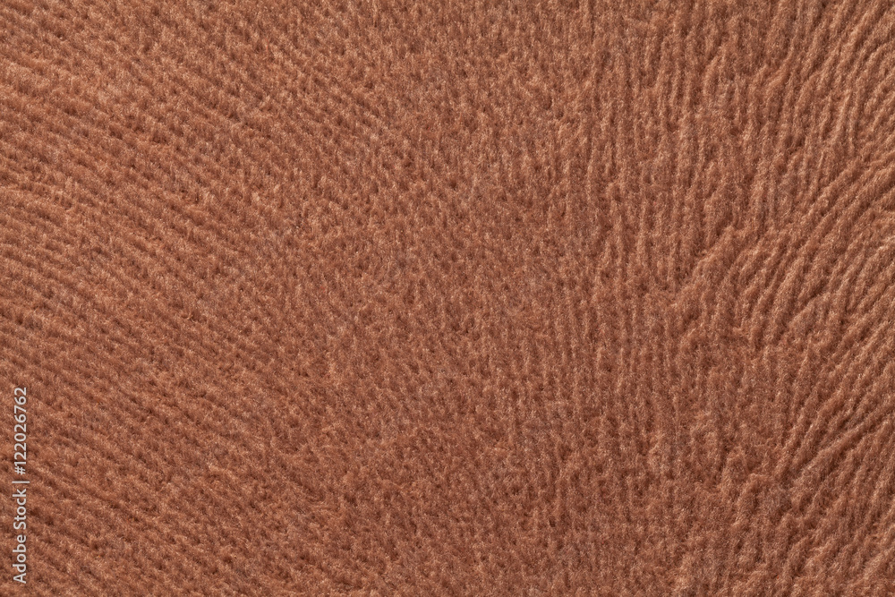 Light brown background from soft textile material. Fabric with natural texture. Light brown background from soft textile material. Fabric with natural texture.