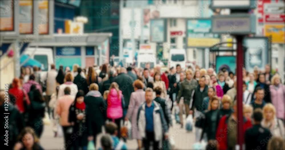 Crowd of People / Commuters Walking / Busy Street. Crowd on a busy street. People walk down a busy street with advertising, billboards, cars and public transport. Slow motion. Crowd of People / Commuters Walking / Busy Street. Crowd on a busy street. People walk down a busy street with advertising, billboards, cars and public transport. Slow motion.