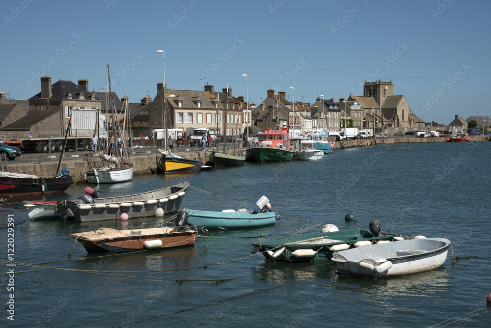 The coastal commune of Barfleur in Normandy northwest France. Boats berthed in the small harbor