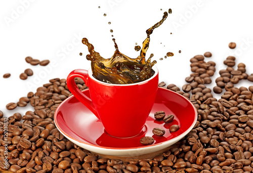 coffee splashing in a red cup on coffee beans