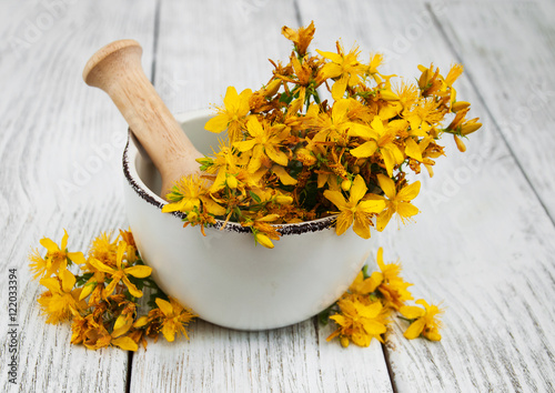 Saint-John's-wort in the mortar photo